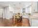 Bright kitchen featuring a center island, stainless appliances, and white cabinetry at 212 Seven Oaks Lndg, Belmont, NC 28012