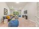 Spacious living room with cozy seating, a TV, and large windows offering a relaxing atmosphere at 212 Seven Oaks Lndg, Belmont, NC 28012