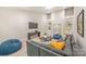 This living room features a high ceiling, built in shelves, a television, and an oversized comfortable couch at 212 Seven Oaks Lndg, Belmont, NC 28012