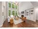 Bright, open-concept living room with a fireplace, hardwood floors, and plenty of natural light at 212 Seven Oaks Lndg, Belmont, NC 28012