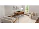 Bright and modern office space featuring a stylish wooden desk, natural light, and comfortable seating at 212 Seven Oaks Lndg, Belmont, NC 28012