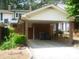 Attached carport providing covered parking and additional storage space for residents at 214 Idlewood Dr, Kannapolis, NC 28083