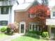 Traditional brick home with manicured front lawn and mature landscaping at 214 Idlewood Dr, Kannapolis, NC 28083