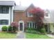 Charming brick townhouse featuring manicured landscaping and mature trees in a desirable location at 214 Idlewood Dr, Kannapolis, NC 28083