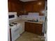 Functional kitchen featuring white appliances, generous counter space, and wood cabinets at 214 Idlewood Dr, Kannapolis, NC 28083