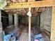 Unfinished basement interior with block walls, exposed rafters and a dirt floor at 2434 Columbus Cir, Charlotte, NC 28208