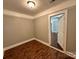 Bedroom features light-colored walls and hardwood floors at 2434 Columbus Cir, Charlotte, NC 28208