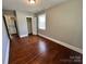 Bedroom featuring hardwood floors and closet at 2434 Columbus Cir, Charlotte, NC 28208