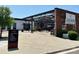 A modern exterior view of Legion Brewing with steel accents, signage, and outdoor seating at 2434 Columbus Cir, Charlotte, NC 28208