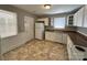 Bright kitchen with neutral walls, white cabinets, granite counters, and white appliances at 2434 Columbus Cir, Charlotte, NC 28208