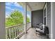 Inviting balcony with comfortable seating and a view of lush greenery at 258 Iverson Way, Charlotte, NC 28203