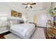 This main bedroom is bright and spacious with decorative tray ceilings and hardwood floors at 258 Iverson Way, Charlotte, NC 28203