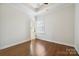 This bedroom is brightened by natural light, hardwood floors, neutral walls, and provides a versatile and comfortable living space at 258 Iverson Way, Charlotte, NC 28203