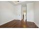 This bedroom features rich hardwood floors, tray ceiling and neutral walls, providing a calm and inviting space at 258 Iverson Way, Charlotte, NC 28203