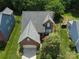Aerial view of a brick home with manicured lawns and mature trees at 2825 Redfield Dr, Charlotte, NC 28270