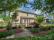 Backyard featuring a manicured lawn, a deck, and mature landscaping at 2825 Redfield Dr, Charlotte, NC 28270