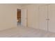 Spacious bedroom with neutral carpet, multiple closets, and access to the staircase, providing comfortable living space at 2825 Redfield Dr, Charlotte, NC 28270