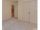 Bright bedroom features plush carpet, neutral walls, and a closet for storage at 2825 Redfield Dr, Charlotte, NC 28270