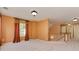 Spacious bonus room with plush carpeting, natural light, and stairway access at 2825 Redfield Dr, Charlotte, NC 28270