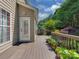 Outdoor deck with potted plants and lush greenery in the background, perfect for relaxation at 2825 Redfield Dr, Charlotte, NC 28270