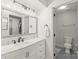 Bright bathroom features a marble countertop, undermount sink, and modern fixtures at 300 E Park Ave # 16, Charlotte, NC 28203