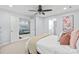 Cozy bedroom boasts a comfortable bed, soft colors, and a view to a living space at 300 E Park Ave # 16, Charlotte, NC 28203