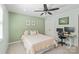 Comfortable bedroom with a ceiling fan, neutral walls, and natural light from the windows at 300 E Park Ave # 16, Charlotte, NC 28203