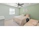 Relaxing bedroom features carpet floors and a bright window, creating a serene space at 300 E Park Ave # 16, Charlotte, NC 28203