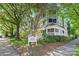 Exterior shot of a well-maintained condominium complex with lush green landscaping at 300 E Park Ave # 16, Charlotte, NC 28203