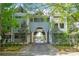 Charming condo complex entrance with brick-paved driveway and manicured landscaping at 300 E Park Ave # 16, Charlotte, NC 28203