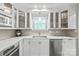 A bright kitchen featuring white cabinets, stainless steel appliances, and hardwood floors at 300 E Park Ave # 16, Charlotte, NC 28203