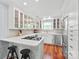 A modern kitchen featuring white cabinets, stainless steel appliances, and hardwood floors at 300 E Park Ave # 16, Charlotte, NC 28203