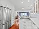 An open kitchen area that flows into the dining and living space creating an inviting atmosphere at 300 E Park Ave # 16, Charlotte, NC 28203