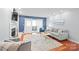 Stylish living room boasts a fireplace, plush seating, hardwood floors, and access to an outdoor balcony at 300 E Park Ave # 16, Charlotte, NC 28203