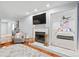 Open living room with fireplace flows to the bedroom through white trim doorway at 300 E Park Ave # 16, Charlotte, NC 28203