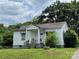 Charming single-story home with a cozy front porch and a well-maintained lawn at 302 Melrose Sw Dr, Concord, NC 28025