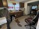 A kitchen with dark cabinets and an adjacent dining area in need of remodeling at 302 Melrose Sw Dr, Concord, NC 28025