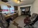 A kitchen with dark cabinets and an adjacent dining area in need of remodeling at 302 Melrose Sw Dr, Concord, NC 28025