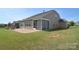 A spacious backyard features an outdoor stone patio, fireplace, a sunroom, and a grassy yard at 3073 Oliver Stanley Trl, Lancaster, SC 29720