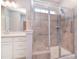 Modern bathroom with shower featuring glass door, tiled walls, and grab bar at 3073 Oliver Stanley Trl, Lancaster, SC 29720