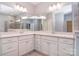 Bathroom featuring double vanity and tiled shower behind glass enclosure at 3073 Oliver Stanley Trl, Lancaster, SC 29720