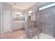 Modern bathroom with glass-enclosed shower, tiled walls, and double vanity sinks at 3073 Oliver Stanley Trl, Lancaster, SC 29720