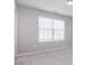 This bedroom features neutral carpeting and a window with coverings at 3073 Oliver Stanley Trl, Lancaster, SC 29720