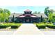 Attractive community clubhouse features stone accents, mature landscaping, and a brick walkway in a park-like setting at 3073 Oliver Stanley Trl, Lancaster, SC 29720