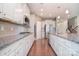 Modern kitchen featuring stainless steel appliances, white cabinetry and a granite-topped island at 3073 Oliver Stanley Trl, Lancaster, SC 29720