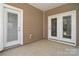 Covered patio featuring a light colored floor and view of the outdoor area. Features two exit doors at 3073 Oliver Stanley Trl, Lancaster, SC 29720
