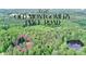 Aerial shot of property and wooded lot with pond at 3116 Old Montgomery Place Rd, Monroe, NC 28112