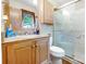 Bathroom with a granite countertop vanity, a toilet, and a glass enclosed shower at 3116 Old Montgomery Place Rd, Monroe, NC 28112
