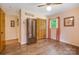 Bedroom with peach walls, wood-style flooring and double door closets at 3116 Old Montgomery Place Rd, Monroe, NC 28112