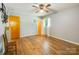 Bedroom showcasing hardwood floors, light gray walls, a ceiling fan, and a bright window at 3116 Old Montgomery Place Rd, Monroe, NC 28112